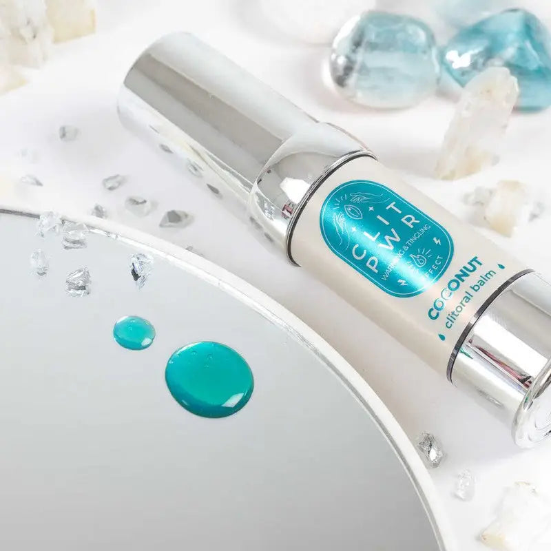 Baume stimulant pour clitoris à la noix de coco, avec pingouin clitoris et stimulateur vibro. disponible chez LollyDoll