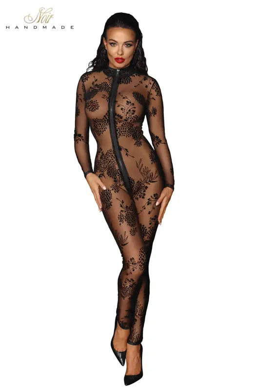 Combinaison noire transparente à motifs floraux avec fermeture éclair.