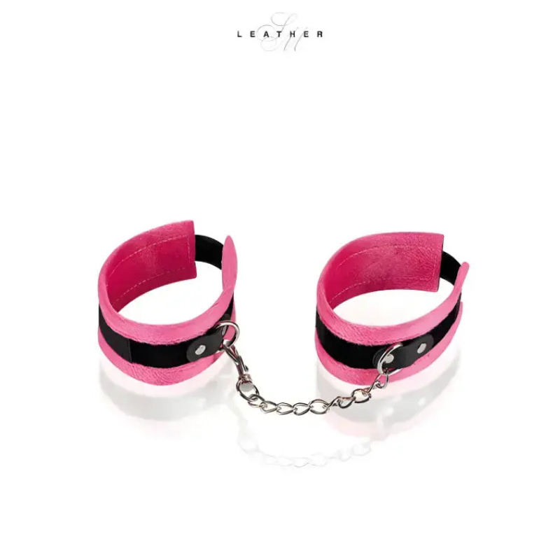 Menottes de chevilles en cuir rose et noir avec chaîne, accessoire pour jeux de rôles et sensualité.