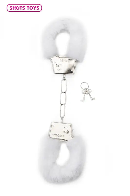 Menottes blanches en peluche avec clés.