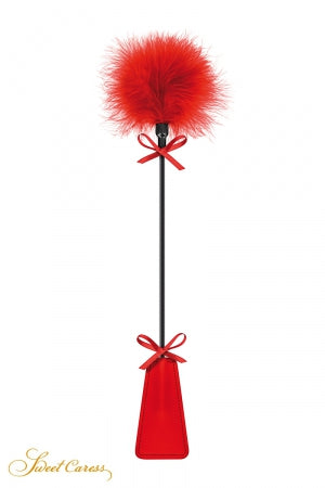 Tapette à pompon rouge