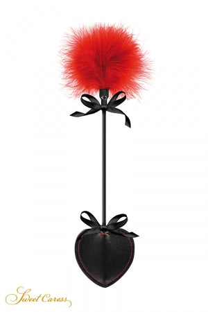 Tapette pique avec pompon rouge