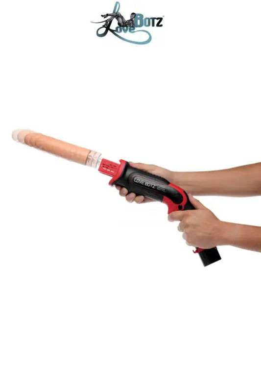 Pistolet sex toy noir et rouge.