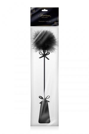 Tapette avec pompon noir