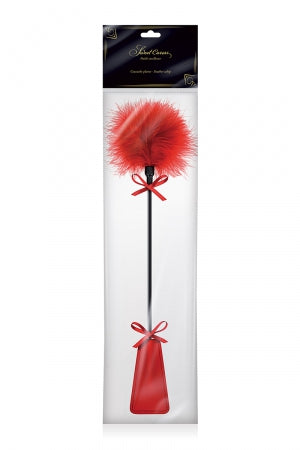 Tapette à pompon rouge