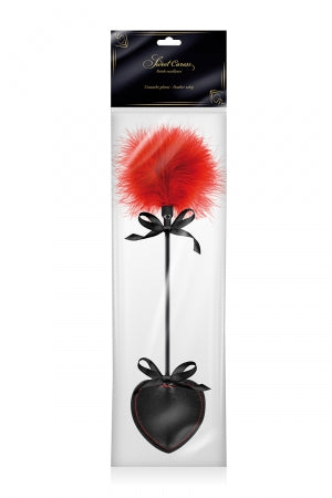 Tapette pique avec pompon rouge