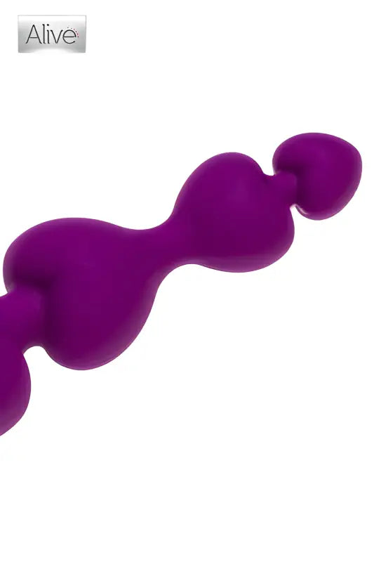 Objet de plaisir en perles violettes.