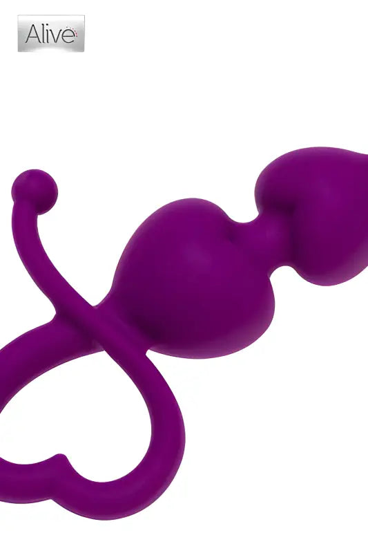 Perles anales violettes avec tirette en forme de cœur.